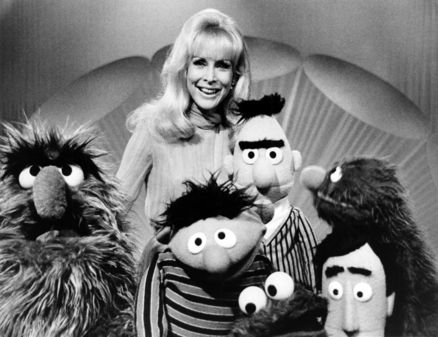 Another still of Barbara Eden with Herry Monster, Ernie, Bert, Grover, Cookie Monster and Guy Smiley.