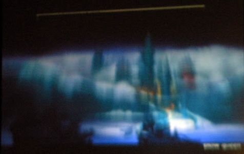 A blurry screenshot of a 2009 D23 presentation on the film.