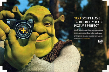 A press ad that uses an image of Shrek holding a camera.