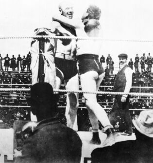 The boxers in a clinch. Corbett's revealing appearance has been cited in theories attempting to explain the abundance of women during film screenings.