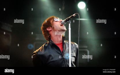 Lead-singer-of-pop-band-oasis-liam-gallagher-performing-at-finsbury-park-last-night8-july-2002-photo-andy-paradise-2FMA0MP.jpg