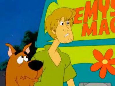 Shaggy Rogers and Scooby-Doo in one of the in-game cutscenes, utilizing a 2D animation style similar to the television series.