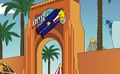 A Jay Leno avatar reaching the Universal gates in the "Catapult to Krustyland" game.