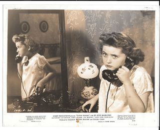 A still showing Iodine talking on a telephone.