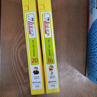2 VHS tapes of the dub, volumes 16 and 20, spine view.