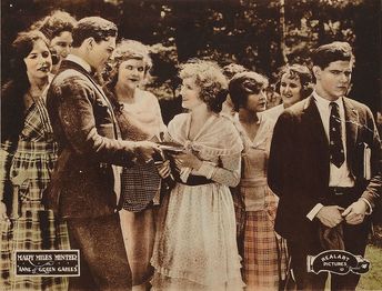 A lobby card for the film depicting a scene.