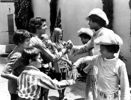 A still showing the Brady kids handshaking The Jackson 5.