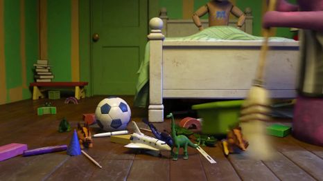 Screengrab of the Pixar movie Monsters University, from 2013, where the early version of Arlo makes a cameo appearance in toy form.