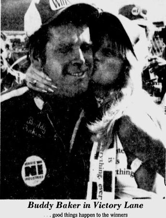 Baker receives a kiss in Victory Lane.